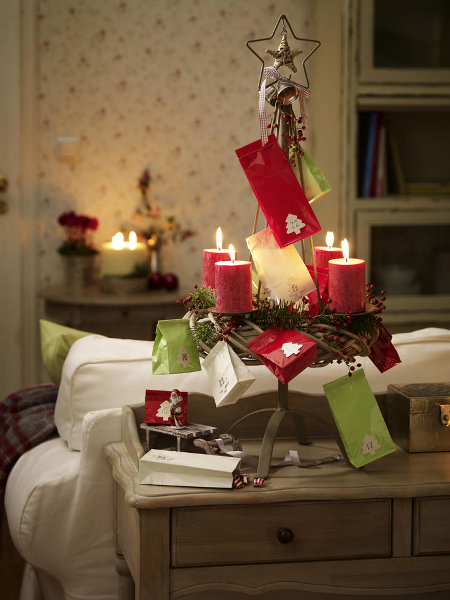 festive-table-candlestick-small-colored-paper-bags-fancy-ornamental-fir-tree-motif