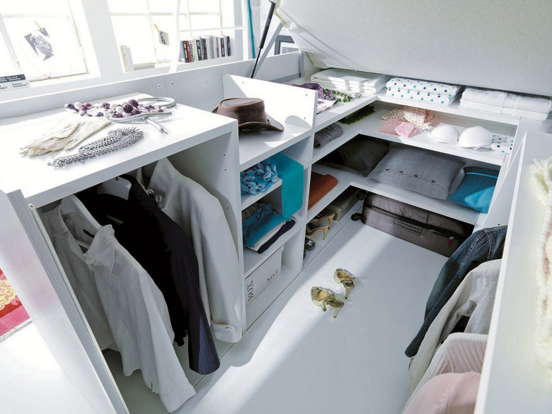 a-full-closet-is-hidden-under-this-bed-img5